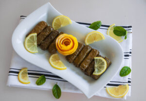 Stuffed Grape Leaves rolls with slices of lemon